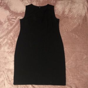 Knee length black sleeveless dress